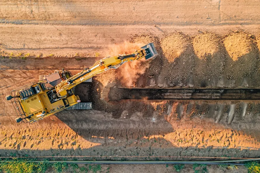 Overhead view of a utility trench being cut